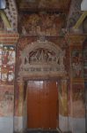 Title: Ramalinga Vilasam Palace Date: First half of the 18th centuryDescription: Room 1, south door: Painted stucco image of Gaja Lakshmi and, above it, a mural depicting Minakshi's wedding; On the wall projection on the right: Muthu Vijaya Raghunatha Setupati paying homage to Gaja Lakshmi. Location: Tamil Nadu Palace;Ramanathapuram Positioning: Room 1, south wall