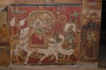 Title: Ramalinga Vilasam Palace Date: First half of the 18th centuryDescription: The processional images of Umamaheshvara on Nandi and Minakshi (?) on hamsa accompanied by fly-whisk, insignia and umbrella bearers; On the wall projection on the right, lamp bearer Location: Tamil Nadu Palace;Ramanathapuram Positioning: Room 1, west wall