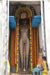 Title: Jaina Monuments; Tirumalai (Polur) Date: 10th centuryDescription: Rock-cut image of the Jain saviour Neminatha, 4.86 m high. The image was commissioned by Kundavai, sister of the Chola king Rajaraja (r. 985-1014). Location: Tamil Nadu Temple;Jaina Monuments;Tirumalai Positioning: Kundavai Jinalaya