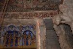 Title: Virupaksha Temple; Hampi Date: First half of the 19th centuryDescription: Vignettes, from left: Pujaris performing a ritual; Sri Virupaksha enshrined; Nandi; Three brahmins; Two courtiers; Two attendants; A male figure bearing a yoke and a retainer; Two drummers; A kettledrum player; A dvarapala.

Plaster sculptures; The wedding of Virupaksha and Pampambika. Location: Karnataka Temple;Virupaksha Temple;Hampi Positioning: Open mandapa, ceiling beam above the entrance to the sanctuary