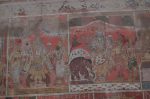 Title: Kallapiran Temple; Srivaikuntham Date: 17th centuryDescription: 108 Srivaishnava divyadeshams. From left; 1) Standing of Vishnu flanked by consorts. 2) Narayana of Tirunavai, blessing Gajendra. On the right, flanked by Malarmangai Nacchiyar, Garuda (?). On the left, the celestial chariot transporting the crocodile, freed from his curse, to Vaikuntha. Location: Tamil Nadu Temple;Kallapiran Temple;Srivaikuntham Positioning: Inner prakara, west wall, top row