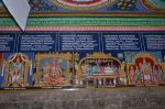 Title: Andal Temple; Srivilliputtur Date: Paintings, late 20th centuryDescription: 108 Srivaishnava divyadeshams. 1)Tirunarayana of Melukote standing and Bibi Nacchiyar seated at his feet;  2) Ramanuja (Udayavar) holding the image of Sellappillai. 3) Sri Vatapatrashayi Perumal of Srivilliputtur reclining on Shesha; Brahma emerges from the lotus issuing from Vatapatrashayi's navel. In the left upper corner is Varaha and in the right, the temple tank. Above the image of the deity: a group of thirteen celestials among them are the personified weapons of Vishnu, the Sun and the Moon. Behind the god are Sri Devi and Bhu Devi. In the foreground, from left: Garuda, Markandeya maharishi, the festival images of the deity and his consorts, Bhrigu maharishi and Periyalvar. 4) Sri Nindranarayana of Tiruttangal flanked by his consorts: Sridevi  (Annanayaki) and Nila Devi (Anantanayaki) are on the right and Bhu Devi (Amritanayaki) and Jambavati are on the left. In the right corner is the Papavinasa tank and the tiger refers to King Chandraketu who, because of a curse, was born as a tiger and obtained salvation here. In the upper left corner are the goddess in a separate shrine, and near it, Garuda. Location: Tamil Temple;Andal Temple;Srivilliputtur Positioning: Inner prakara, south wall