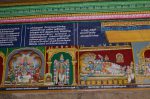Title: Andal Temple; Srivilliputtur Date: Paintings, late 20th centuryDescription: 108 Srivaishnava divyadeshams.1) Aravindalochanan of TiruTolaivillimangalam (one of the Navatirupati) seated on the coils of the serpent Shesha, flanked by his consorts. 2) Sri Mayakkuttan of Tirukkulandai (Perunkulam, one of the Navatirupati) standing. On the bottom left is the goddess. 3) Sri Vaittamanidhi Perumal of Tirukkolur reclining on Shesha; Brahma emerges from the lotus issuing from Vaittamanidhi's navel. Standing on the right: Kubera and Madurakavi alvar.  In the upper right corner is the goddess. The nine containers in the foreground symbolise the Navanidhis, the nine treasures belonging to Kubera. Location: Tamil Nadu Temple;Andal Temple;Srivilliputtur Positioning: Inner prakara, south wall