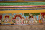 Title: Andal Temple; Srivilliputtur Date: Paintings, late 20th centuryDescription: 108 Srivaishnava divyadeshams.  1) Sri Makaranedungulaikadan of TenTiru Perai seated on Sheha and flanked by his consorts; 2) Sri Adinatha Perumal, of Tirukkurugur (Alvar Tirunagari) standing, flanked by his consorts. Above them are two smaller shrines dedicated to Adinatha's consorts. On the extreme left is the Varaha shrine. 3) The main scene depicts Satkopan (Nammalvar) seated beneath the tamarind tree, in whose branches is an image of Sri Ranganatha. He is flanked on the left, by Tiruvaimolipillai, and Madurakavi, and, on the right, by Nathamuni and Manavalamamuni. Location: Tamil Nadu Temple;Andal Temple;Srivilliputtur Positioning: Inner prakara, south wall