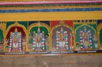 Title: Andal Temple; Srivilliputtur Date: Paintings, late 20th centuryDescription: 108 Srivaishnava divyadeshams. 1) Sri Pambaneyappan of Tiruvanvandur (Tiruvanmundur); On the left, the goddess, behind her is Narada and, on the right, Markandeya. 2) Sri Kolappiran of Thiruvalla standing, flanked by Selva Tirukolundu Nacchiyar on the left, and by Ghantakarna (?) on the right. 3) Sri Arbutha Narayana of Tirukkadittanam standing, flanked by Karpakavalli Nacchiyar on the left, and by Rukmangatha Raja on the right. 4) Sri Tirukkuralappan of Tiruvaranvilai (Aranmula) standing, flanked by Padmasani Nacchiyar on the left, and by Brahma on the right. Location: Tamil Nadu Temple;Andal Temple;Srivilliputtur Positioning: Inner prakara, south wall