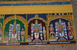 Title: Andal Temple; Srivilliputtur Date: Paintings, late 20th centuryDescription: 108 Srivaishnava divyadeshams. 1) Sri Appan of Tirukatkarai (Tirukatkarra) standing, flanked on the left by Perunselva Nacchiyar, and by Kapila muni, on the right. 2) Sri Tirumulikkalattan of Tirumulikalam standing, flanked on the left by Maturaveni Nacchiyar  and by Harita muni on the right. 3) Sri Uyyava Perumal (Uyyavanda Perumal) of Tiruvittuvakkodu standing flanked, on the left by the goddess and king Ambarisha (?), and by Kulashekhara Perumal on the right. Location: Tamil Nadu Temple;Andal Temple;Srivilliputtur Positioning: Inner prakara, south wall