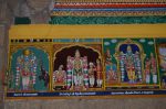 Title: Andal Temple; Srivilliputtur Date: Paintings, late 20th centuryDescription: 108 Srivaishnava divyadeshams.  1) Sri  Narayana of Tirunavai standing, flanked by Malarmangai  Nacchiyar, on the left, and Gajendra on the right.  2) Sri Alagiyamanavala of Tiru Uraiyur (Woraiyur) standing, flanked by the Kaveri River on the left, and by Tiruppan alvar and Dharma Varma Raja on the right. 3) Sri Pundarikaksha Perumal of Tiruvellarai, standing, flanked by Pankayachelvi Nacchiyar on the left, and by Sri Uyyakkontan (Veyakkondan acharya) and Enkalalvan acharya on the right. The most important tirhas -shown at the top- are (from left): Divyapushkarini, Pushkala tirtha; Kusha tirtha; Chakra tirtha. Location: Tamil Nadu Temple;Andal Temple;Srivilliputtur Positioning: Inner prakara, south wall
