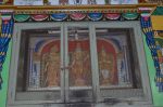 Title: Andal Temple; Srivilliputtur Date: Paintings, late 20th centuryDescription: Tableau depicting the images of Sri Andal, Rangamannar, and Garudalvar as seen in the innermost sanctuary of the temple. Location: Tamil Nadu Temple;Andal Temple;Srivilliputtur Positioning: Inner prakara, west wall