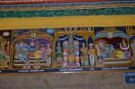 Title: Andal Temple; Srivilliputtur Date: Paintings, late 20th centuryDescription: 108 Srivaishnava divyadeshams. 1) Sri Valvil Raman (Kolavili Raman) of Tiruvelliyankudi reclining on Shesha. Brahma emerges from the lotus issuing from Valvil Rama's navel. In the foreground, from left are: Sukracharya, Garuda and Periyavachan Pillai standing. Behind the deity are Parasara maharishi (?) and Bali (?). In the left top corner: Sri Markatavalli Nacchiyar, and in the right hand corner the Amirma tirtham. 2) Sri Amaruviyappan of Therlandur (Thiruvalundur) standing flanked by Chengamalavalli Nacchiyar and King Parisavasu (Uparisavasu) on the left and, on the right, by an ascetic (?), Kaveri Amman, Dharmadevata and Kamban. 3) Sri Parimalaranganatha (Parimala Rangarajan) of Tiru Indalur reclining on Shesha, with Chandra at his feet. Brahma emerges from the lotus issuing from Parimala Rangarajan's navel. In the foreground, Pundarikavalli Thayar (?). Location: Tamil Nadu Temple;Andal Temple;Srivilliputtur Positioning: Inner prakara, west wall
