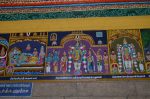 Title: Andal Temple; Srivilliputtur Date: Paintings, late 20th centuryDescription: 108 Srivaishnava divyadeshams. 1) Sri Arulmakadal of Sirupuliyur, reclining on Shesha. Brahma emerges from the lotus issuing from Arulmakadal's navel. In the foreground, his consort,Thirumamangal Nacchiyar, and at his feet, Vyaghrapada and Kalvar munis; 2) Sri Selariraja Perumal (Sowriraja Perumal) of Tirukkannapuram standing and, from left: Vibhishana alvar, Tirumangai alvar(?), the deity's consorts Padmini(?) and Tiru Kannapura, an araiyar (singer), and Kanva maharishi.  In the top left and right corners , the goddess shrine and the temple tank 3) Sri Bagtaravi Perumal (Bhaktavatsala Perumal) of Tirukkannamangai  standing. He is flanked on the left by Abhishekavalli Nacchiyar and by a rishi, Markandeya (?) and by Varuna, on the right. Location: Tamil Nadu Temple;Andal Temple;Srivilliputtur Positioning: Inner prakara, west wall