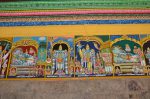 Title: Andal Temple; Srivilliputtur Date: Paintings, late 20th centuryDescription: 108 Srivaishnava divyadeshams. 1) Sri Govindaraja of Tiruchitrakutam (Chidambaram) reclining on Shesha with his consorts at his feet.  Brahma emerges from the lotus issuing from Govindaraja's navel. In the foreground is Sri Pundarikavalli Nacchiyar, and from left: Kanva maharishi, Patanjali, one of the three-thousand (Brahmins), Nandi playing the mridanga and Panini. On the right: Nataraja and behind him the Tillai forest. The Pundarika pushkarini (tank), mentioned in the inscription, is shown in the right top corner.  2) Sri Deivanayakan (Devanathaswamy) of Tiruvahindrapuram, standing. On the left are Vaikunthanayaki, and Chandra; on the right Kotrapati (?) and a winged figure.The inscription mentions the Garuda Nadi tank. In the left upper corner is the hill with its 74 steps enshrining Lakshmi and Hayagriva, on the right, the Shesha tirtham. 3) Sri Trivikraman of Tirukkovalur (Tirukkoilur), standing. Brahma lustrates his raised right foot. On the left, from top to bottom are: Mrikandu rishi and a couple. In the foreground: Pungovil (Pushpavalli) Nacchiyar, Prahlada, King Mahabali at the feet of Vishnu, Namuchi, Sukracharya, Durga. On the right are: three alvars Poigai, Butha and Pey, and Shesha. The inscription mentions the Krishna tirtham. 4) Sonnavannam Saida Perumal of Tiruvehka (Kanchipuram) reclining on Shesha. Brahma emerges from Sonnavannam Saida Perumal's navel. In the foreground, from left are: the consort goddess, Sarasvati, Kannikannan, and standing at the feet of the reclinig god,Tirumalisai alvar and a rishi. The Poikai pushkarini (tank) is mentioned in the inscription. Location: Tamil Nadu Temple;Andal Temple;Srivilliputtur Positioning: Inner prakara, north wall