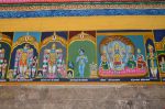 Title: Andal Temple; Srivilliputtur Date: Paintings, late 20th centuryDescription: 108 Srivaishnava divyadeshams. 1) Sri Jagdisha Perumal of Tiruniragam (Kanchipuram) standing, flanked by Sri Nilamangaivalli Nacchiyar on the left and Akrura mahamuni on the right. The inscription mentions the Akrura tirtham. 2) Sri Kalvar of Tirukkarvanam (Kanchipuram) standing flanked by his consort on the left, and Parvati on the right. 3) Sri Kannan of Tirukkalvanur (Kanchipuram) standing carrying butter balls in his hands. On the left: Vatapatrashayi, and the consort goddess; On the right, Vishnu; 4) Sridevi, Paramapadanatan Vishnu, Bhudevi, Nila Devi and Sri Villi chakravarti. Location: Tamil Nadu Temple;Andal temple;Srivilliputtur Positioning: Inner prakara, north wall
