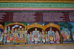 Title: Andal Temple; Srivilliputtur Date: Paintings, late 20th centuryDescription: 108 Srivaishnava divyadeshams. 1) Sri Chakravarti Tirumahan (i.e. Rama) inTiru Ayodhi (Ayodhya). Rama and Sita enthroned. Behind them, on the left, Lakshmana waves a fly whisk; on the right, Bharata holds an umbrella, Shatrughna a fly whisk and a sceptre. Hanuman kneels before Rama holding his foot. The couple are surrounded by rishis and their allies. 2) Sri Devarajan of Naimisharanyam standing flanked on the left by Sudharman Devamaharishi, Sri Harilakshmi, Pundarikavalli Thayar and Indra, on the right. The inscription mentions the Gomti River. 3) Sri Govardhanesan at Tiruvadamaturai (Govardhan)  flanked by Devaraja (Indra) on the left and  Satyabhama on the right. 4) Sri Radhakrishna of Vrindavanam, on the bank of the river Yamuna.  Location: Tamil Nadu Temple;Andal Temple;Srivilliputtur Positioning: Inner prakara, north wall
