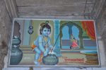 Title: Andal Temple; Srivilliputtur Date: Paintings, late 20th centuryDescription: Krishna stealing butter. Location: Tamil Nadu Temple;Andal Temple;Srivilliputtur Positioning: Inner prakara, east wall