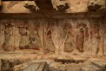 Title: Virabhadraswamy Temple; Lepakshi Date: First half of the 16th centuryDescription: Ramapattabhisheka (Rama's coronation); Hanuman reverently holds Rama's right foot in his hands; On Rama's right was probably Sita; On the left are Rama's allies. Location: Andhra Pradesh Temple;Virabhadraswamy Temple;Lepakshi Positioning: Natyamandapa, first bay from the west