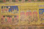 Title: Atmanatha Temple; Avudaiyarkoyil (Tirupperunturai) Date: Paintings: late 19th, early 20th centuryDescription: Top row: The story of Kutruva nayanmar;  Bottom row: The story of Poyyadimai Illadha Pulavar; On the right: Umamaheshvara flanked by Vighneshvara and Subrahmanya with consorts. Location: Tamil Nadu Temple;Atmanatha Temple;Avudaiyarkoyil Positioning: Sivananda Manikkavachakar shrine, prakara, north wall